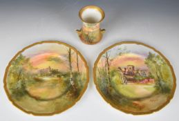 Pair of Royal Doulton hand decorated cabinet plates with gilt rims, the first named verso 'Arundel