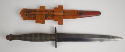 Fairbairn Sykes style fighting knife with ribbed grip, 16.5cm double edged blade and scabbard.