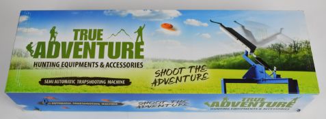 True Adventure semi-automatic clay pigeon shooting trap, unused in original box.