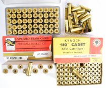 Ninety .310 Cadet brass rifle cartridge cases including some Kynoch in original box, together with