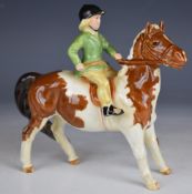 Beswick girl on a skewbald pony, H14cm