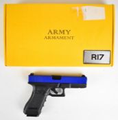 Army Armament 6mm CO2 airsoft pistol with textured composite grip and fixed sights, serial number