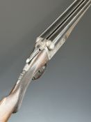 F Baxter 10 bore side by side shotgun with engraved lock, trigger guard, thumb lever, fences and