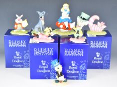 Royal Doulton seven Walt Disney Showcase figures comprising from Alice In Wonderland Alice, Cheshire