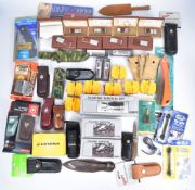 A collection of knives and knife related items including Leatherman, Victorinox and Kershaw,