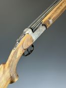 Sabatti 12 bore over and under ejector shotgun with engraved locks, underside, trigger guard, top
