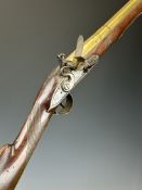 English flintlock blunderbuss with engraved brass butt plate, trigger guard and mounts, chequered