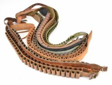 Nine leather shotgun cartridge belts suitable for 20 and 12 bore, including some leather.