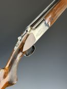 Miroku 12 bore over and under ejector shotgun with engraved locks and underside, chequered semi-