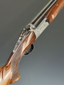 Arkrom 12 bore over and under ejector shotgun with chequered semi-pistol grip and forend, single