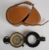 British prismatic compass by Lawes Rabjohns Ltd, London, with leather case