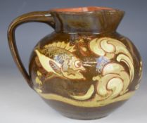 C. H Brannam, Barnstaple art pottery barum ware jug decorated with fish signed and dated 1892 to
