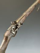 Eastern flintlock musket with carved decoration to the stock, two barrel bands, steel ram-rod and 37
