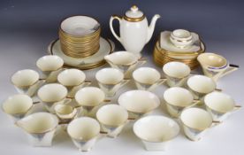 Royal Doulton Art Deco teaware decorated in the black and gold Tango pattern with additional milk