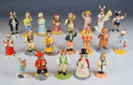 Twenty Royal Doulton Bunnykins figures including Irishman, Detective, Judy, Tyrolean Dancer, Cowboy,