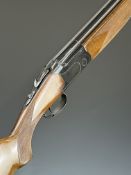 Lanber 12 bore over and under ejector shotgun with border engraved locks and underside, chequered