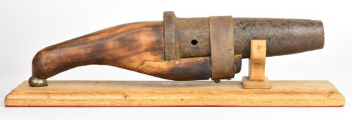 Japanese matchlock ōdzutsu or hand cannon with wooden handle and 10 inch cast iron barrel, overall