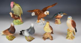 Seven Beswick birds with matt glaze including red and grey pigeons, woodpecker etc, tallest 22cm