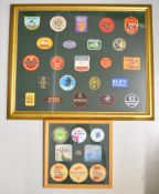 Two framed displays of gun, cartridge and shooting related patches, badges etc including Eley,