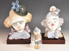 Two Lladro clown busts on stands, models 5130 and 5610, and a Lladro Eskimo figure, tallest 30cm