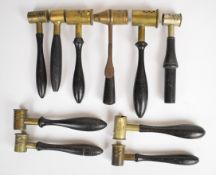 Ten antique brass gun powder measures including James Dixon & Sons and one with sprung mechanism,