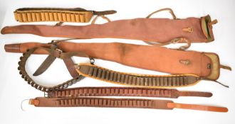 Seven shotgun slips and cartridge belts including leather and canvas examples, the slips by Brady of