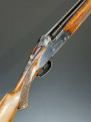 Sarasquetta 12 bore over and under ejector shotgun with border engraved sidelock plates, trigger