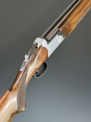Sarriugarte 12 bore over and under ejector shotgun with engraved locks and underside, chequered