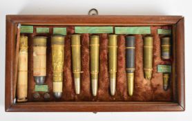 Rifle cartridge framed display case/ board of ten cartridges including Snider, Lee Metford, muzzle