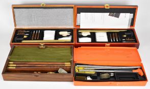 Four shotgun or rifle cleaning kits including Hoppe's.