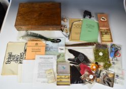 Fly tying vice in wooden case with some trout flies, books and accessories