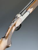 Sportsmarketing Maestro 20 bore over and under ejector shotgun with engraved locks, underside,