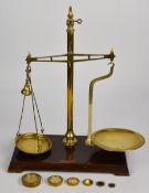 Avery beam scale with brass pans and beam to weigh 4oz, on marked base, with weights from 8oz to ¼
