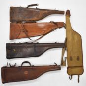Five leg of mutton shotgun carry cases comprising four leather and one canvas and leather.