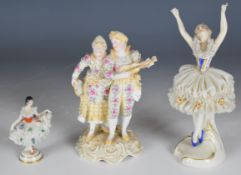 Three 19th / 20thC German porcelain figures comprising Volkstedt musicians and Dresden lace