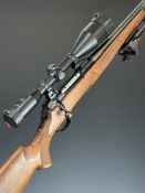 Titan .243 bolt-action rifle with chequered semi-pistol grip and forend, raised cheek piece, bi-pod,