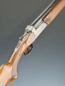 Breda 12 bore over and under shotgun with engraved birds and dogs to the locks and underside,