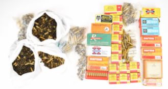 A large collection of mainly brass empty rifle cartridge cases including some primed examples,