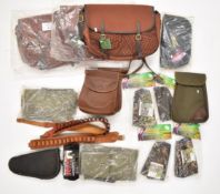 A collection of gun and shooting related items including Bisley game bags, Roller Gun Carrier,