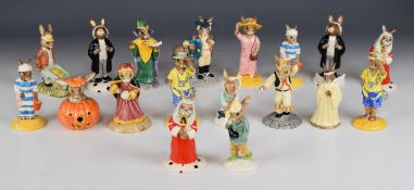 Eighteen Royal Doulton Bunnykins figures including Tourist, Morris Dancer, Judge, Liberty Bell,