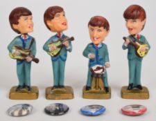 The Beatles set of four vintage cake topper bobble head / nodding caricatures of the band members,