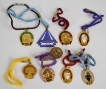 Nine Leopardstown metal and enamel horse racing badges including 1912-1913, 1927-1928 and 1933-1934