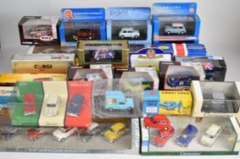 Thirty-two Mini-Cooper related diecast model cars and multi-car boxed sets, manufacturers to include