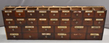 19th / 20thC apothecary / chemist / shopfitting chest of thirty drawers, some with Latin script,