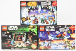 Three Lego Star Wars Christmas Advent Calendars comprising set numbers 75097, 75023 and 75056, in