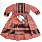 Victorian children's tartan dress with velvet and lace trim with a pair of shoes circa 1880