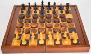 A large folding chess and backgammon board together with boxwood chess and draught sets, 45 x 38cm