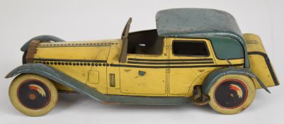 Wells & Co of London clockwork tinplate car with cream body, blue arches and roof, black