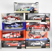Nine 1:18 scale diecast model rally cars and similar to include manufacturers Solido, Sun Star,