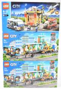Three Lego City sets comprising two Train Station 60335 and Museum Break In 60008, in sealed boxes
